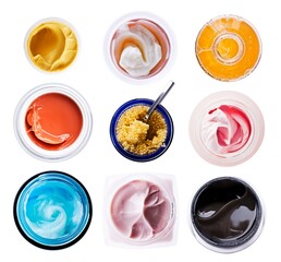 Set of jars of cream and cosmetics isolated on white background. Top view