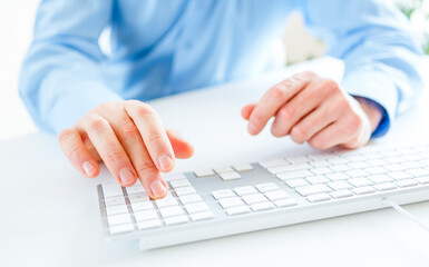 Men office worker typing on the keyboard