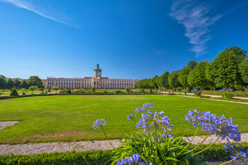 Berlin, Germany - July 19, 2022 : back side at Charlottenburg Palace (Schloss) the Baroque summer palace with garden - 746189651