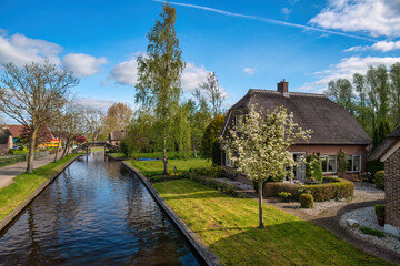 Giethoorn Netherlands, city skyline at canal and traditional house in Giethoorn village