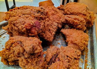 Yummy food - Fried chicken basket in golden light. Selective focus.
