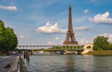 Fototapeta na wymiar Paris France, city skyline at Eiffel Tower and Seine River with Bir-Hakeim Bridge
