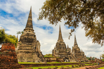 Fototapeta premium From below of ancient Wat Phra Si Sanphet Buddhist temple in Ayutthaya, Thailand