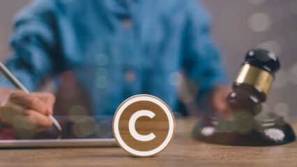 Copyright document folder with attorney works at law firm. concept of digital copyright laws.