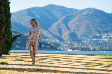 Woman walk near nature with Italian mountain background. Sexy Girl full body outdoor.