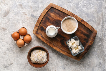 Composition with different ingredients for preparing bakery on grunge background