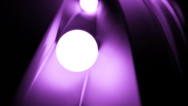Small light balls rolling among narrow metal track. Design. Shining white spheres on path.