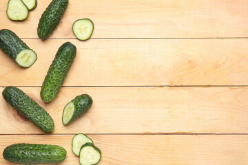 Fresh cucumbers on wooden background