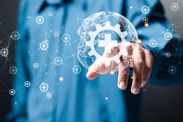 Medical technology concept. Digital healthcare and medicine, internet network connection, Global health network. Businessman touching globe with health IT icon on virtual interface.