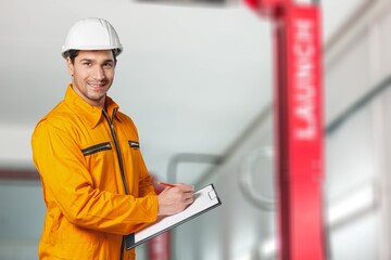 Standing young worker man. Male Auto mechanic