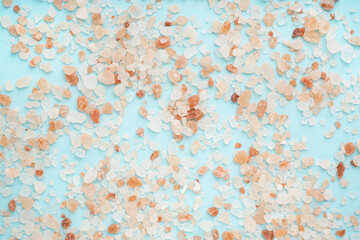 Himalayan pink salt on blue background