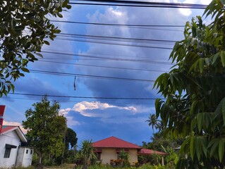 Electrical wires against blue sky