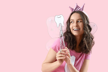 Tooth Fairy with wand on pink background