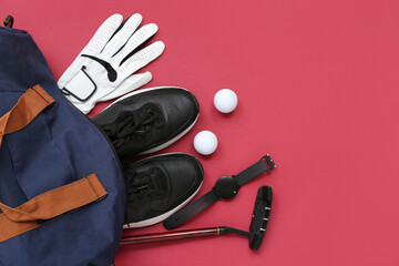 Sports bag with golf equipment on red background