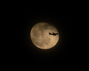Airliner Crossing a Full Moon at Night (three of three)