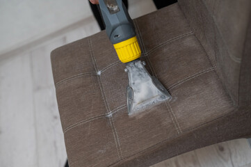 Dry cleaning a fabric chair. 