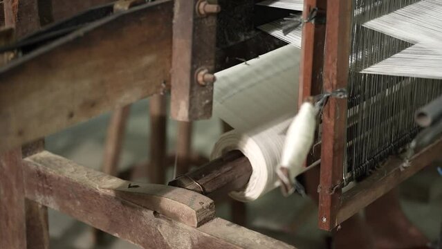 a close-up view of an old and still functional traditional loom