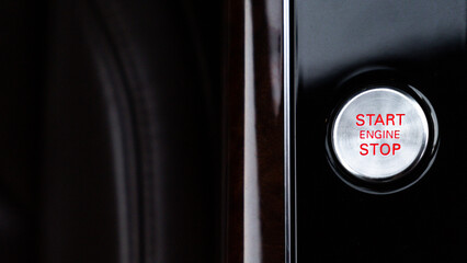 Start engine stop button Interior of modern luxury car. Details of automatic transmission gear...