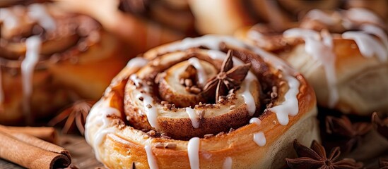A freshly baked cinnamon roll topped with sweet icing and garnished with cinnamon sticks, showcasing a tempting treat for cinnamon lovers.