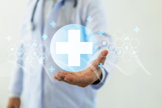 Doctor hold healthcare and medical cross symbol health services and technologies feelings of trust, patient care services, health services, hospital, medical health and life insurance business