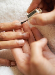 Hands, manicure and nail polish in salon, top view and beauty treatment process to relax. Closeup,...