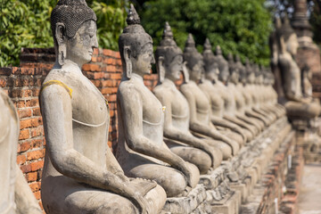 Buddha statues at historic temples of Ayutthaya in Thailand.