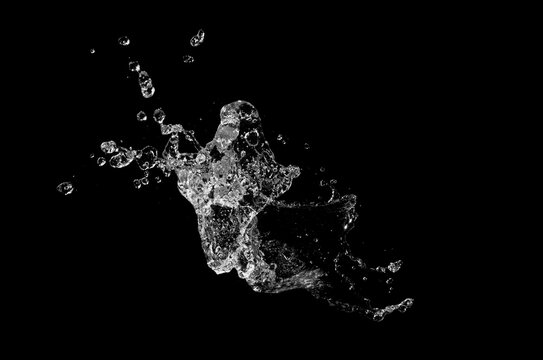 Water splash isolated on black background.