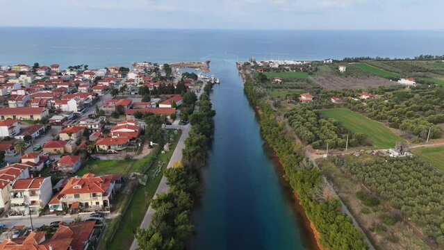 Flying over across the amazing Xerxes canal in Potidea Chalkidiki with crystal clear green Aegean waters