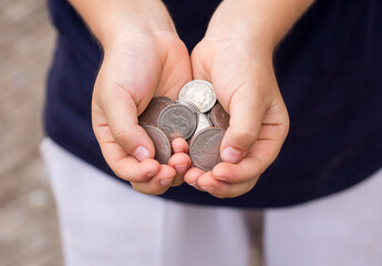 Close up coin in children hand