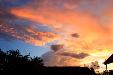 Fantastic red sunset and dark ominous clouds