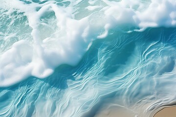 Blue waves on golden beach, top view of waves on coastline, summer beach waves background, colorful...