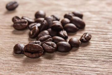 Coffee beans on grunge wooden background