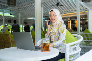 Customer service is contacting customers in a friendly manner at a cafe. photo concept You can work...