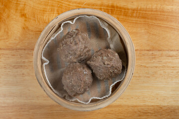 top view fresh beef balls in a bamboo steamer