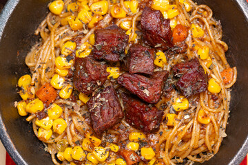 top view fresh black pepper beef pasta at horizontal composition