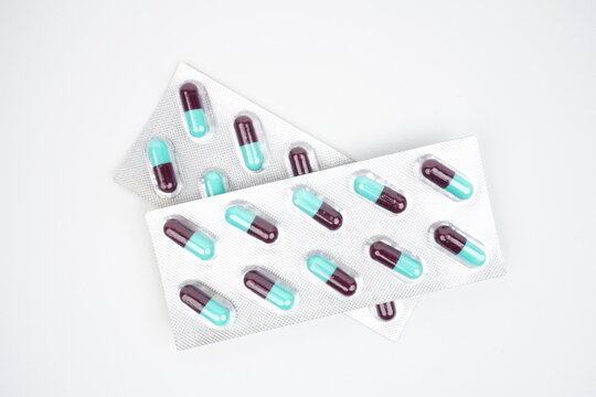 Top view of purple and tosca pill capsules in silver blister pack 2