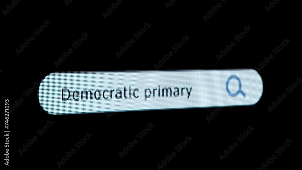 Poster shot of monitor screen. pixel screen with animated search bar, keywords democratic primary typed in,