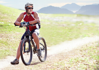 Nature, sports and man athlete with bicycle in park for marathon, race or competition training....