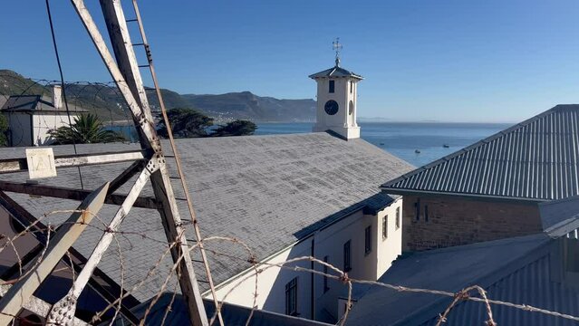 A wide shot of the old clock tower in Simonstown,  Cape Town , South Africa.

In the background we feel the Simonstown naval yard and docks.