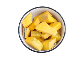 Pieces of pumpkin in a round ceramic bowl on a white background with clipping path. Top view with copy space for your text. 