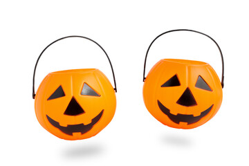 Floating Halloween Jack o Lantern pumpkin bucket, plastic pumpkin isolated on white background with clipping path. Scary halloween's