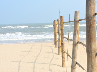 Fence made of woods on the beach.