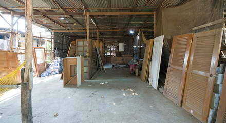 An informal workshop, built by the rustic wooden structure and corrugated metal roofing materials....