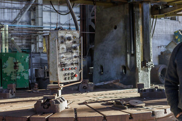 Fototapeta na wymiar Destroyed and abandoned mechanical plant during war in Ukraine.