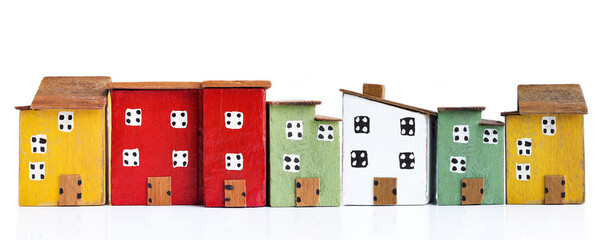 Colorful miniature houses arranged in a row on white background. business financial and rent, loan,...