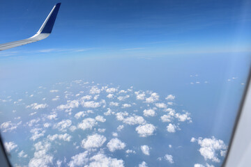 View of clouds from airplane window.