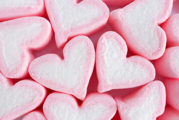 group of pastel pink heart shape marshmallow as background