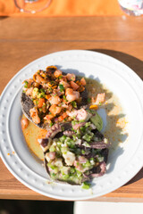 Fish and Octopus Tostadas on a White Plate