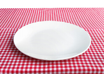 Empty white ceramic plate on table with red checkered tablecloth. clipping path