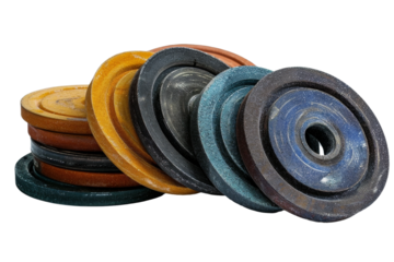A Pile of Different Colored Grinding Wheels. the abrasive discs are used for cutting and grinding metal, stone. Each wheel has a unique thickness and diameter. On PNG Transparent Clear Background.